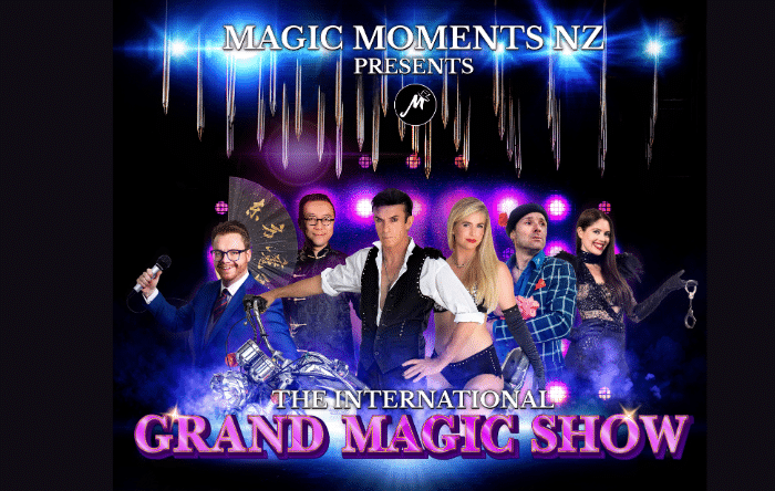 Promotional poster for "The International Grand Magic Show" featuring five magicians with various props against a starry background with the logo "Magic Moments NZ.